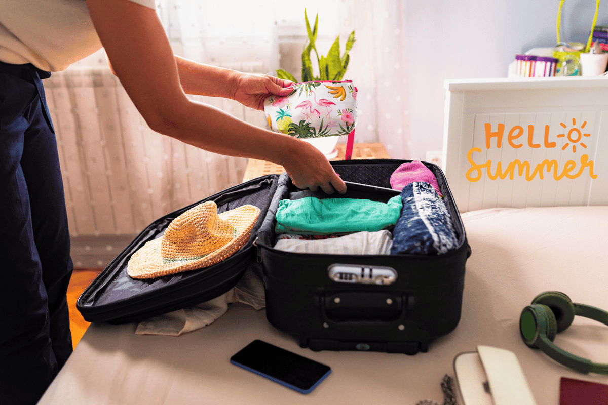 Woman packing summer beauty essentials in suitcase