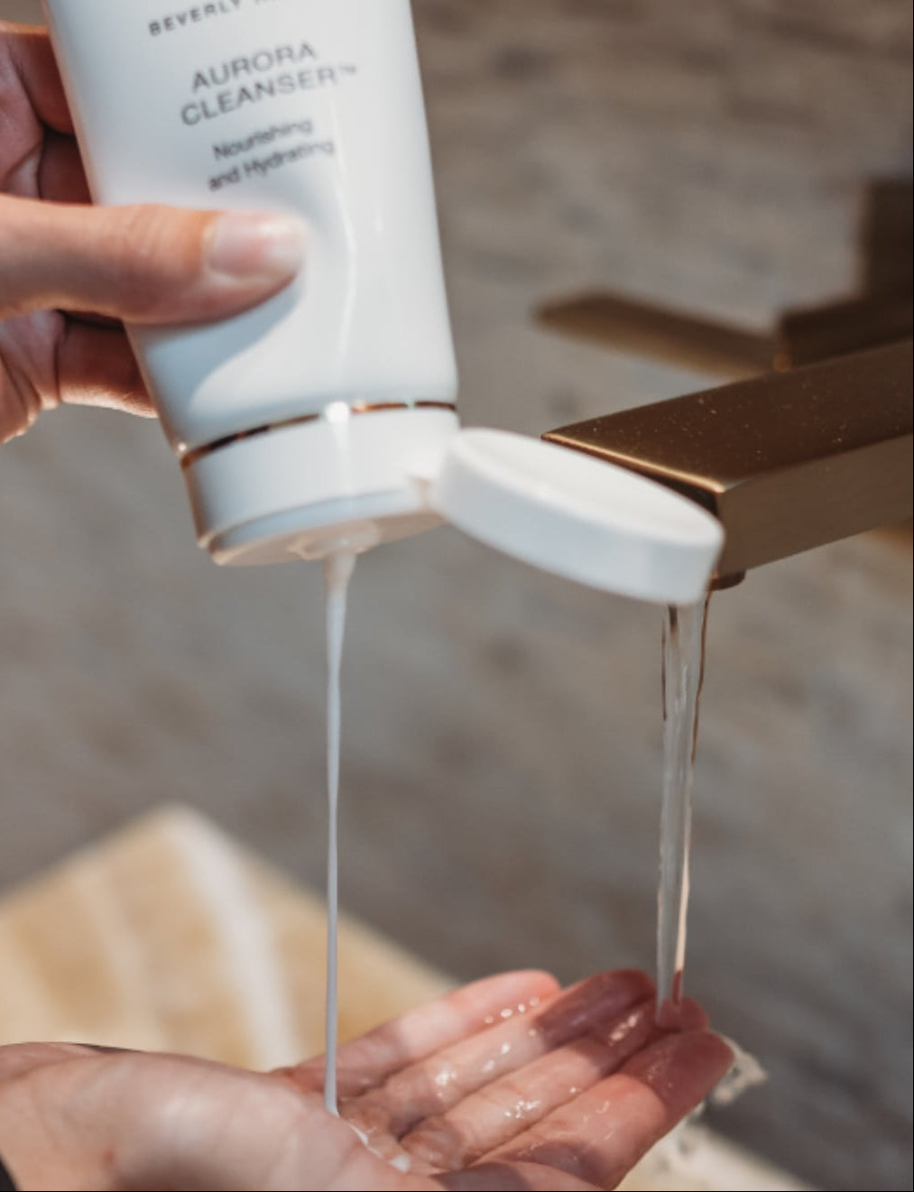 Aurora Cleanser poured into hand