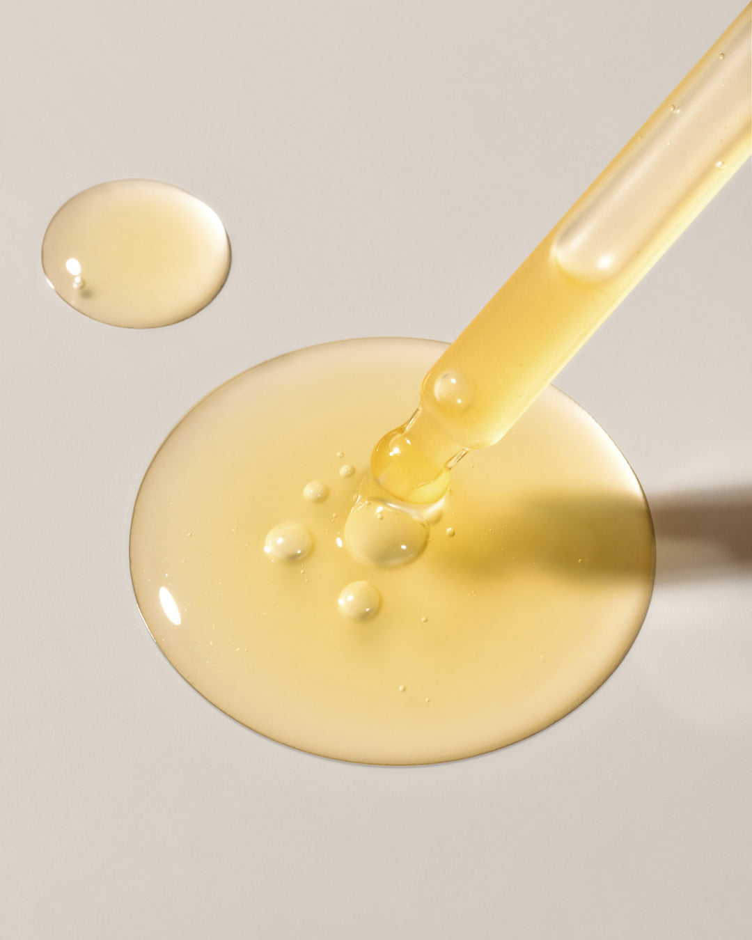 Cx3 Gold Serum dropper texture swatch by EMK Skincare