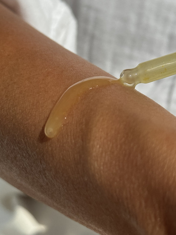 Cx3 Gold Serum texture on arm by EMK Skincare