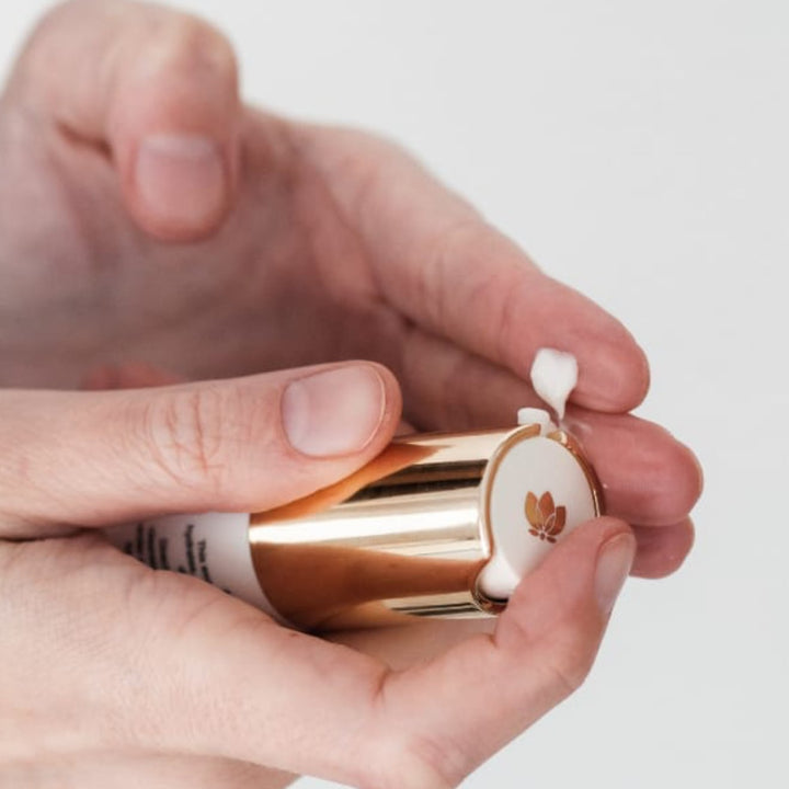 Radical Eye Cream dispensing onto finger by EMK Skincare
