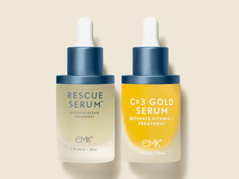 Rescue Serum and Cx3 Gold Serum bottles by EMK Skincare