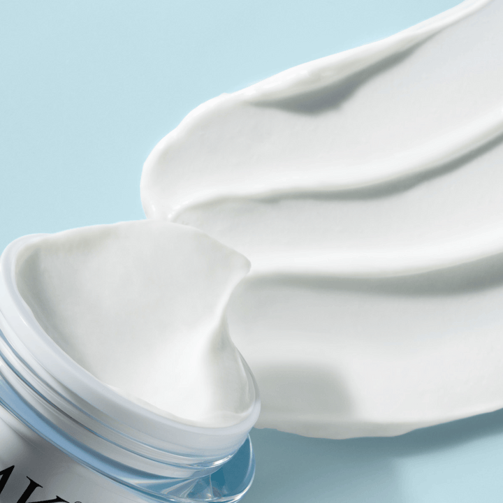 Supra Face Cream jar rim with cream ribbon by EMK Skincare